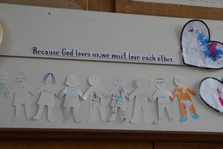 collage of cut out people that have been personalised, underneath the words 