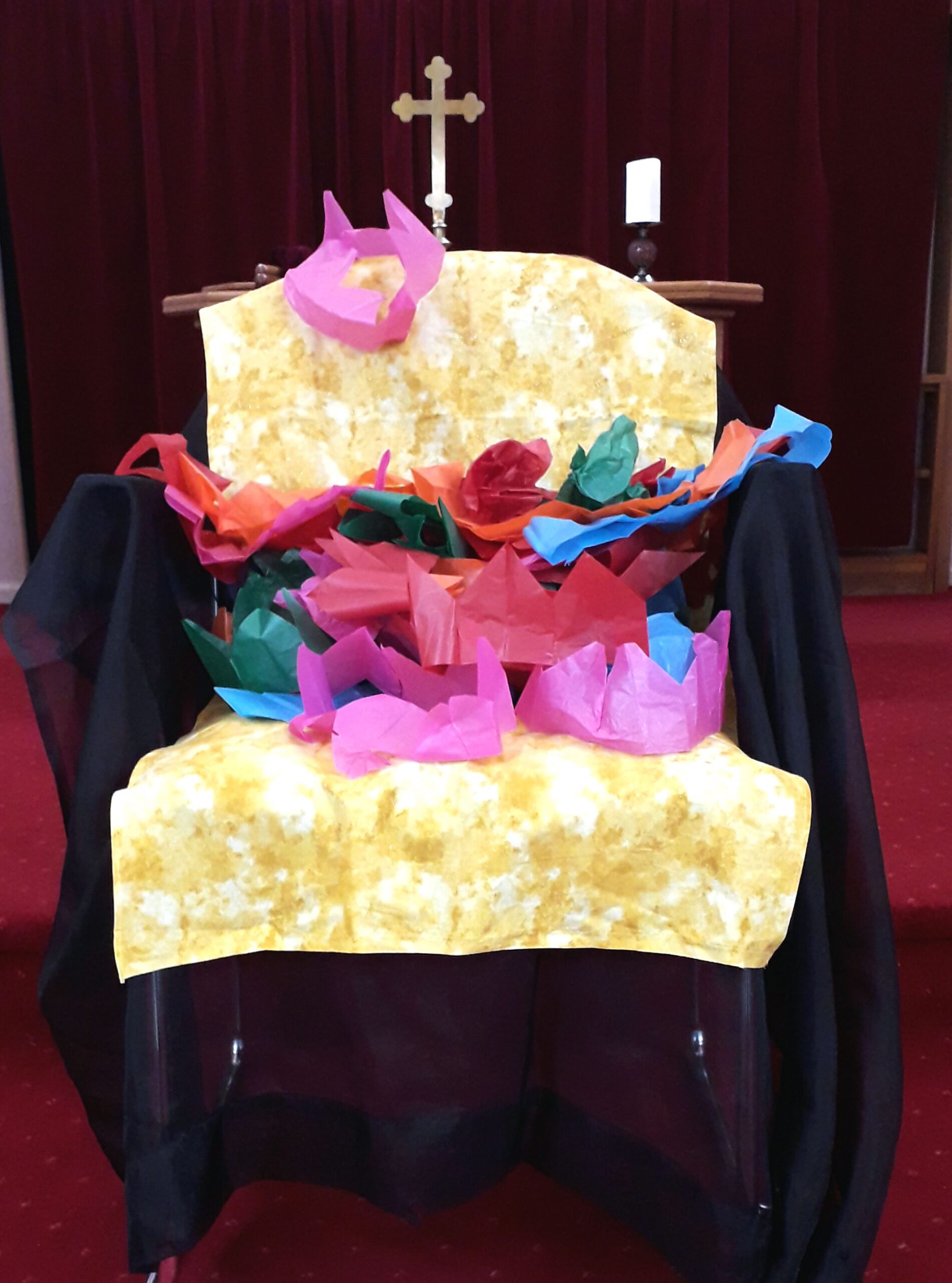coronationtheme Chair covered in paper party crowns