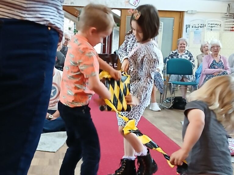 Children trying to open a package