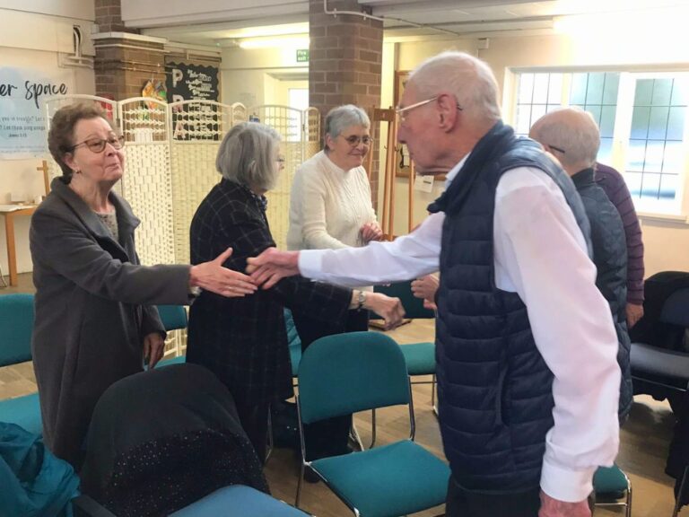 Two adults shaking hands