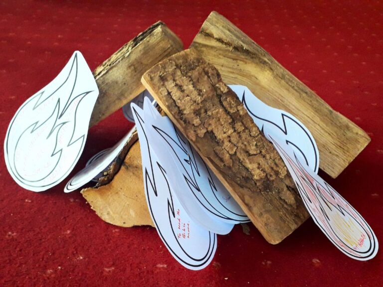Wooden logs with paper flames added to create a fire