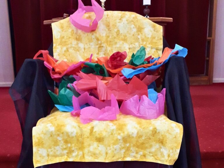 A throne with paper crowns placed on it